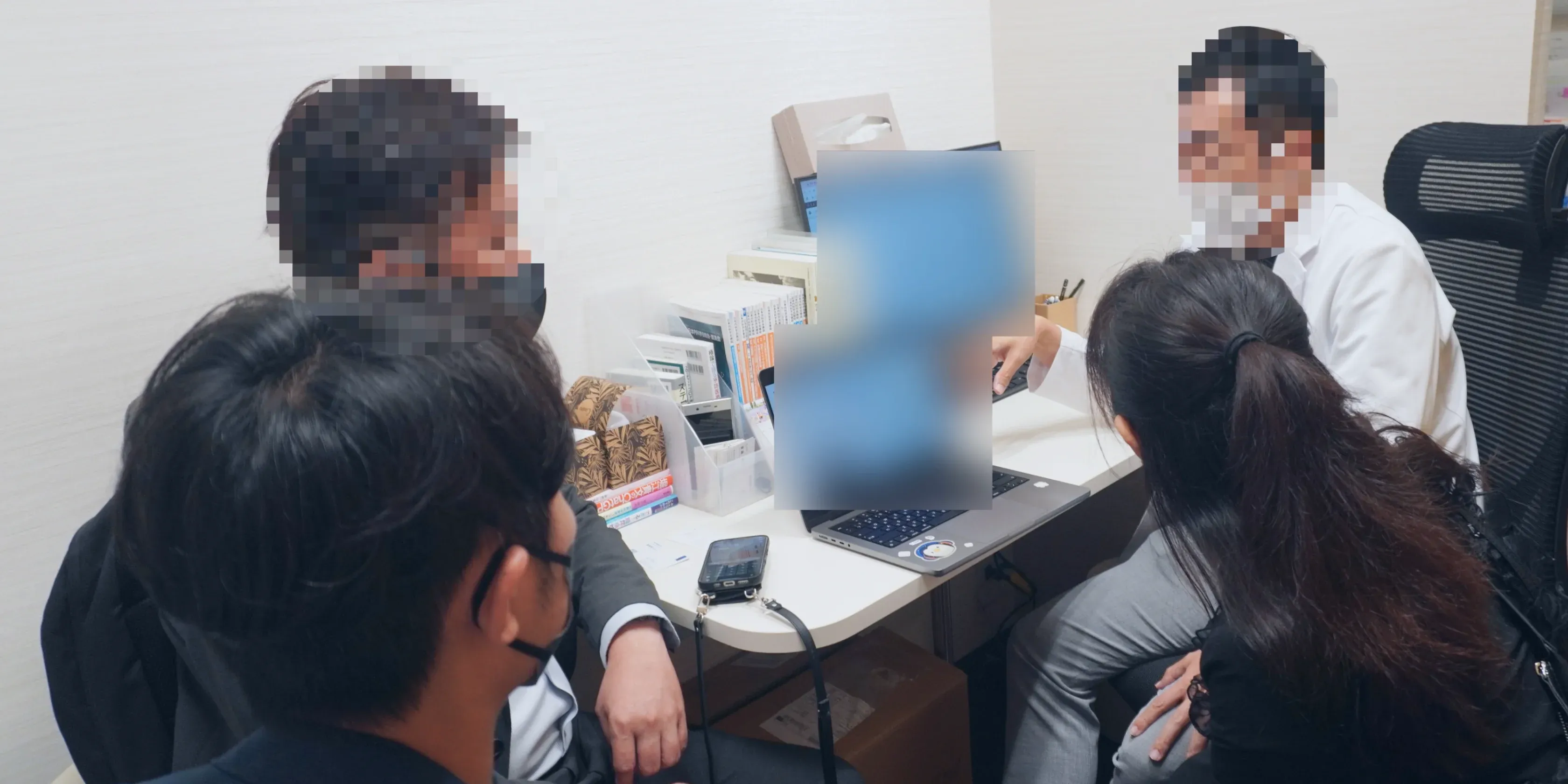 Field interview setup: fewer people in the room, a translator with time to confirm, and a flow diagram on the table